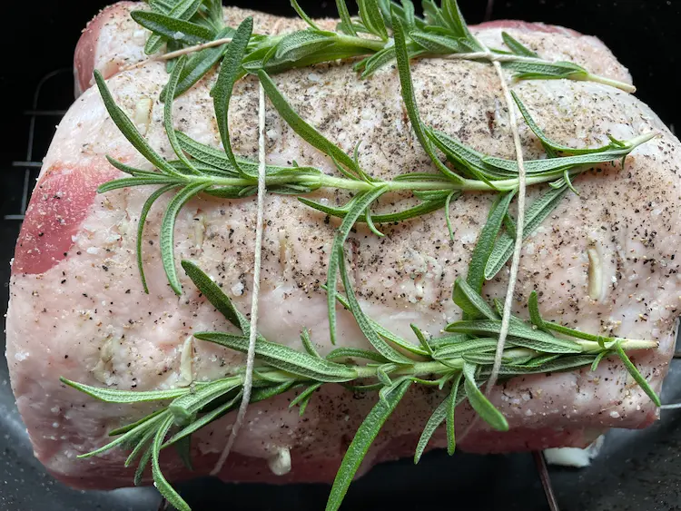 uncooked pork loin roast with rosemary uncooked pork loin roast with rosemary